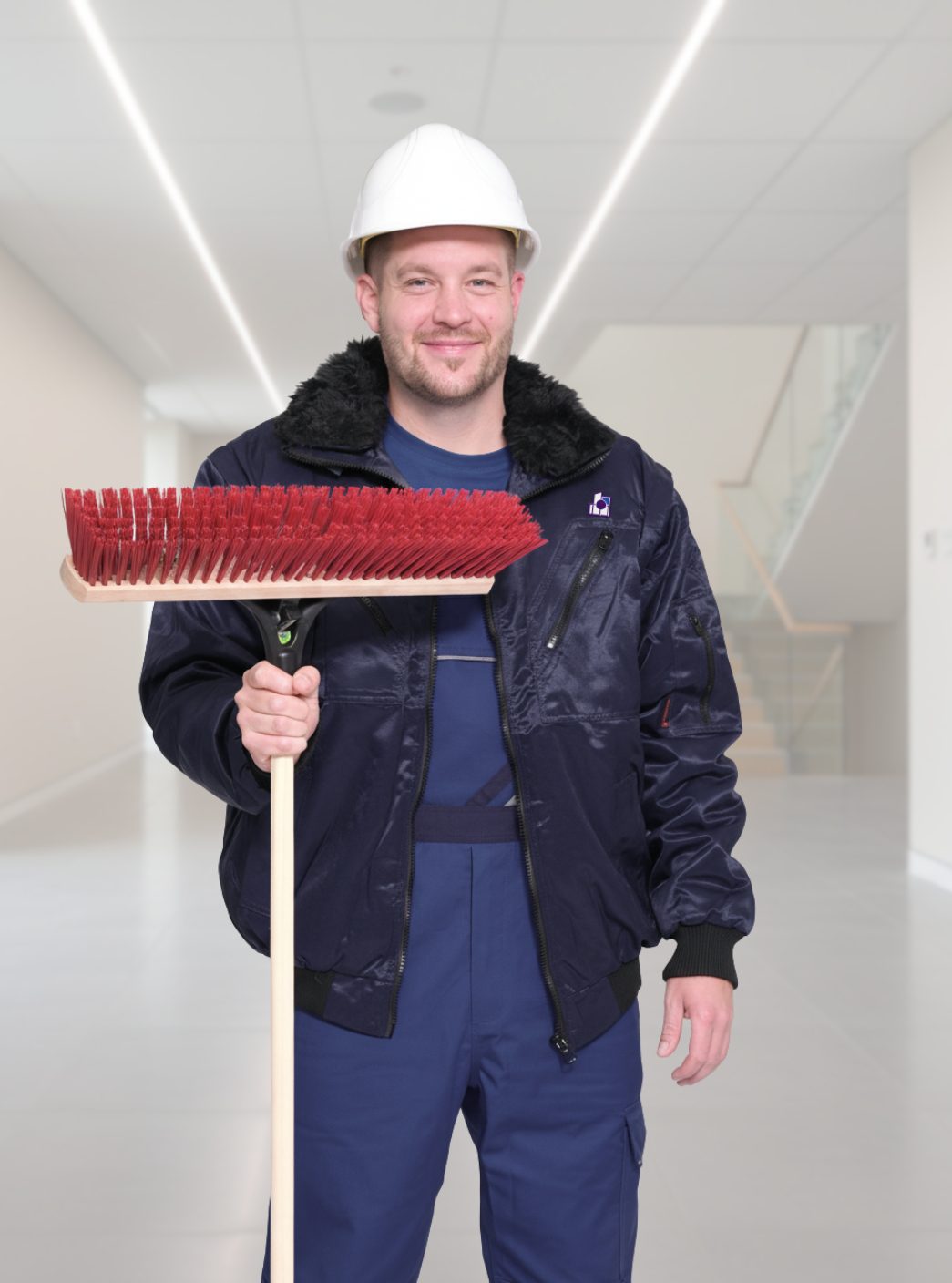 Mitarbeiter von KlarPunkt Gebäudereinigung bei der Baureinigung in Leipzig mit Besen
